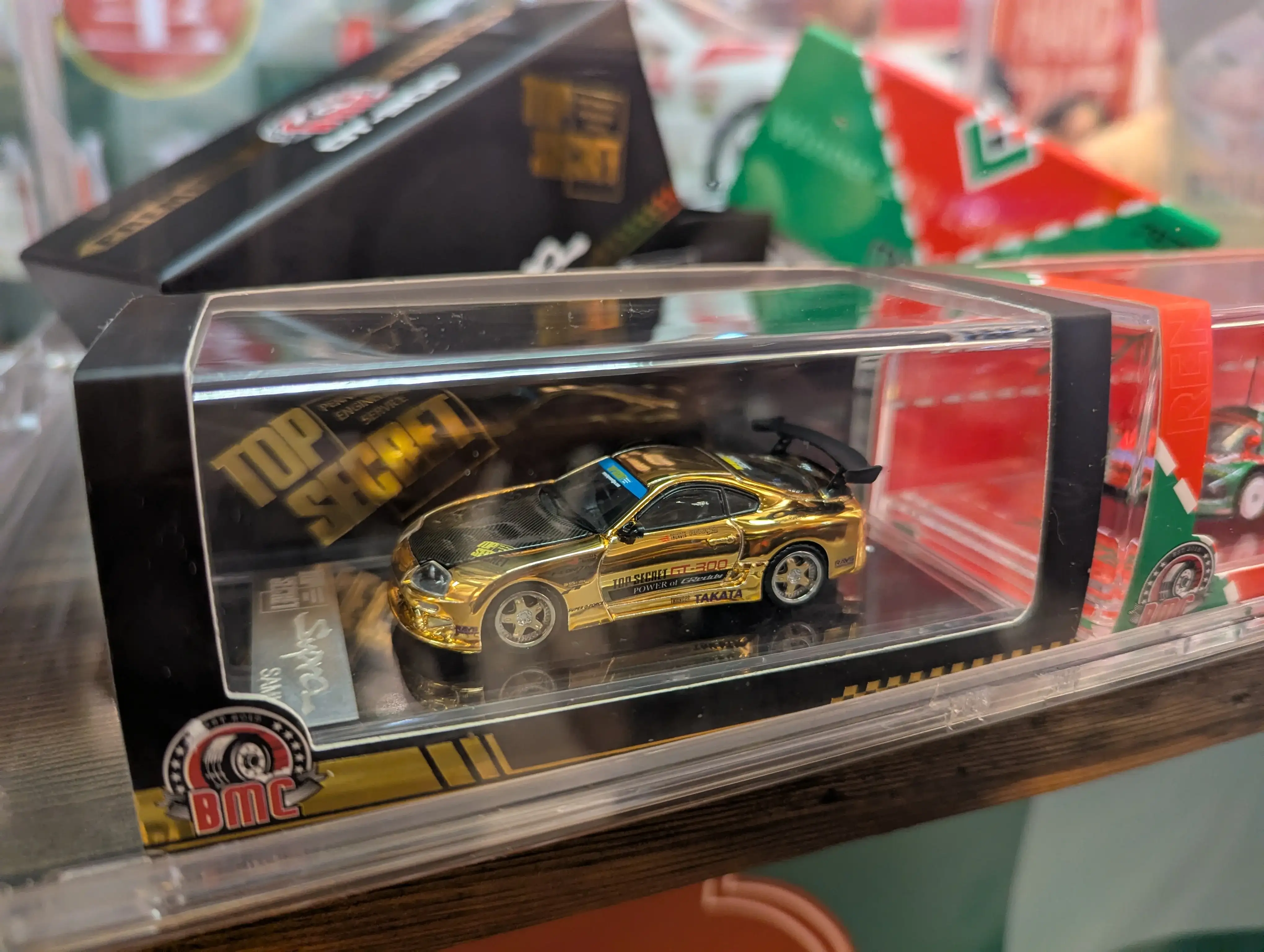 BMC 1:64 Top Secret GT-300 Toyota Supra JZA80 Chrome Gold